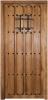 puerta de tablas y ventanuco con reja parte exterior rústica madera nogal