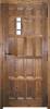 puerta de tablas y ventanuco con reja parte interior rústica madera nogal